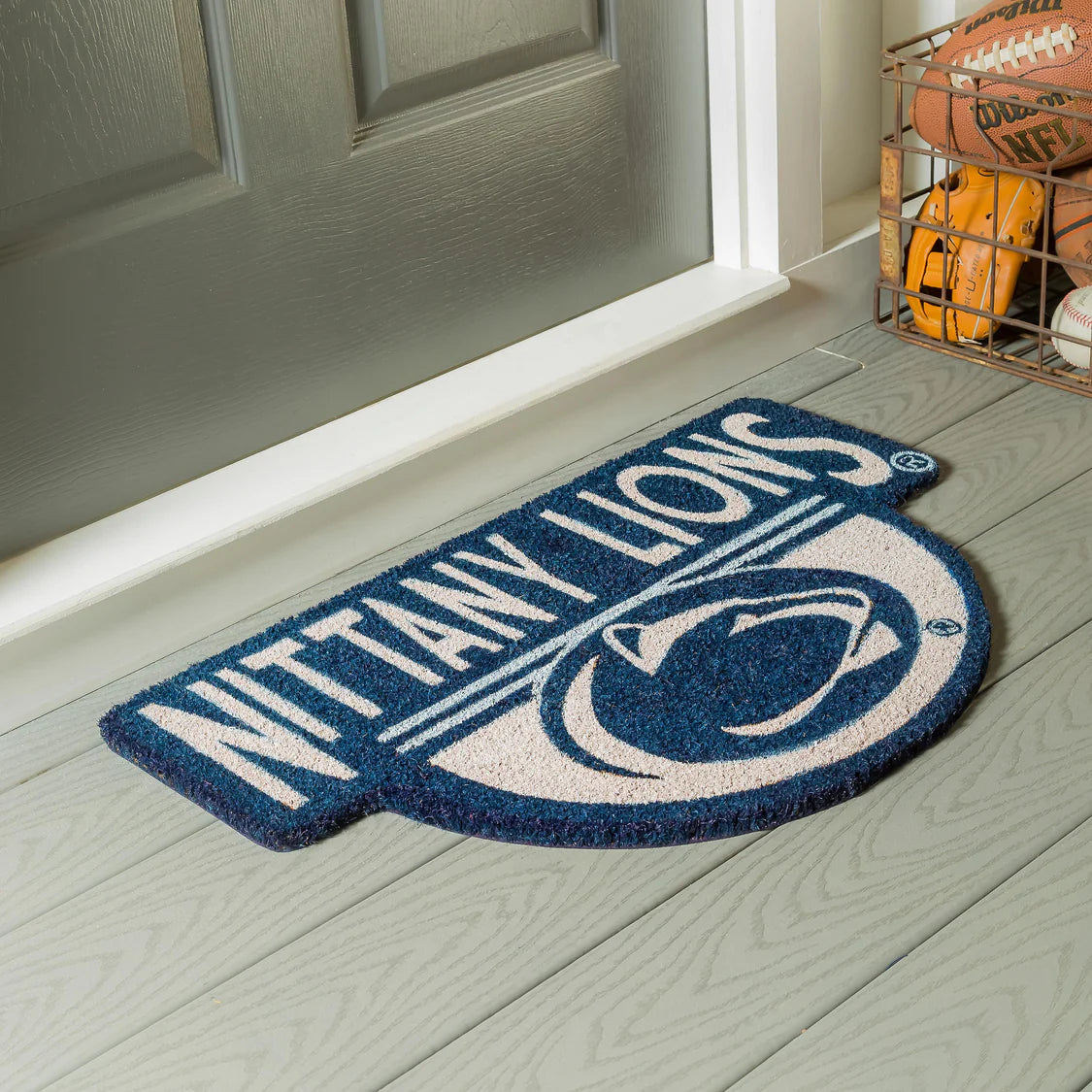 Penn State Nittany Lions Door mat at a front and near a football, baseball, basketball and a baseball glove 