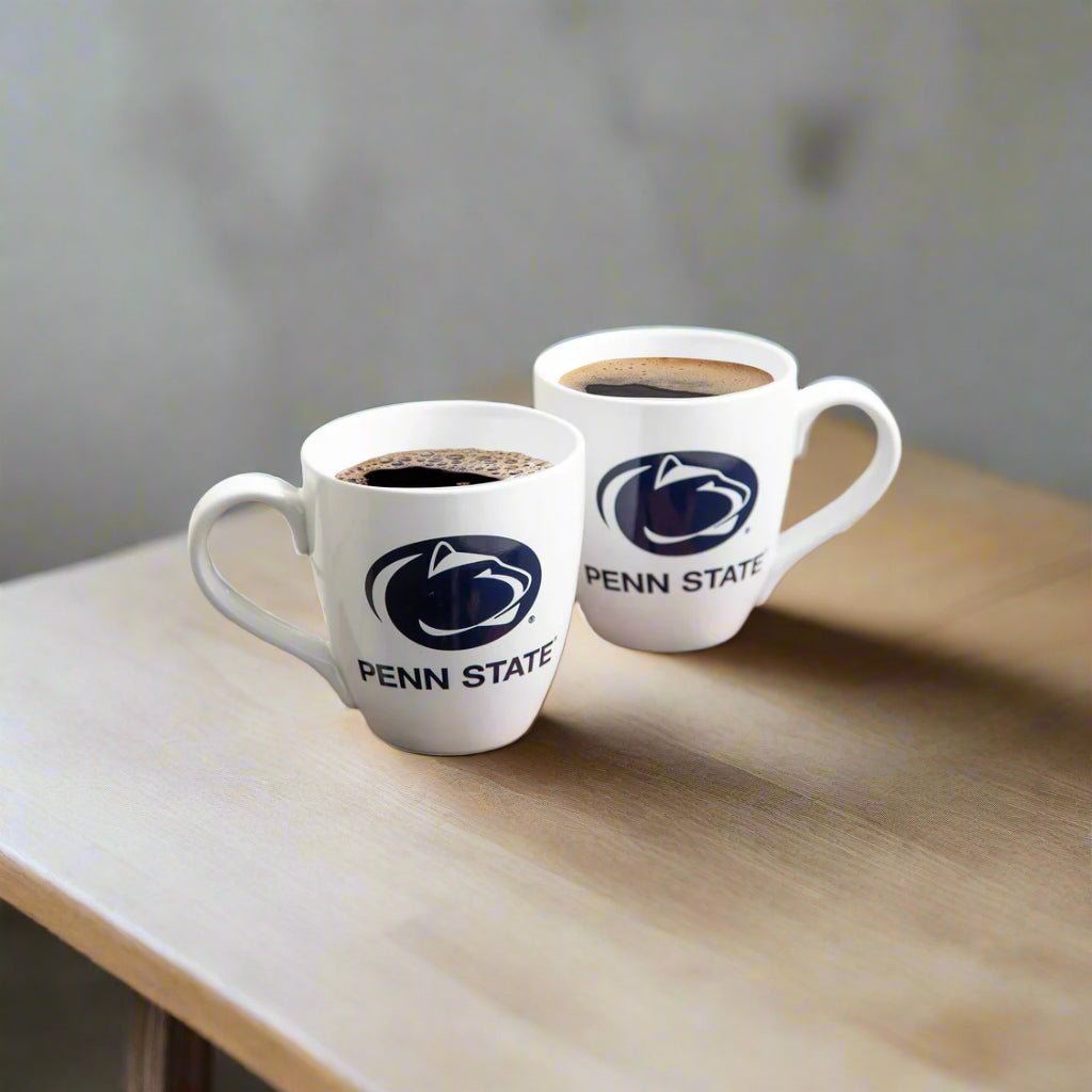 Penn State coffee mugs on a table