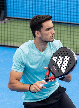 Racket Central man playing padel with black racket