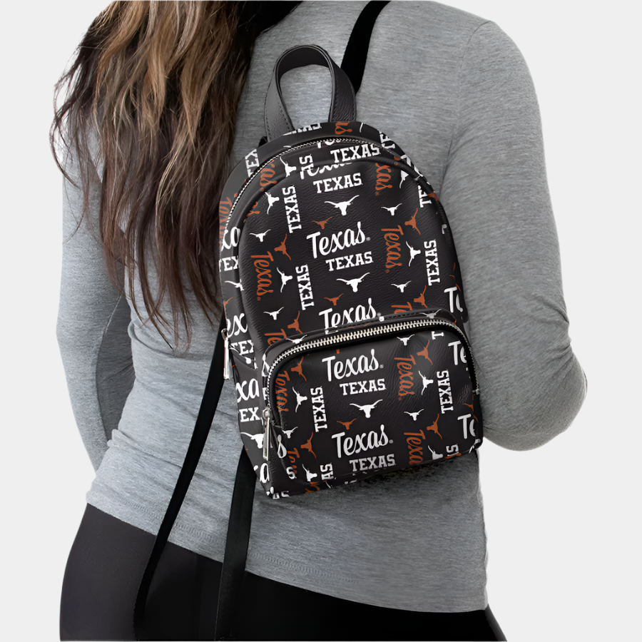 Woman carrying FOCO Texas Longhorns Youth Black Repeat Brooklyn Mini Backpack